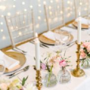 Brass candlesticks and gold charger plates, styling by Elizabeth Weddings